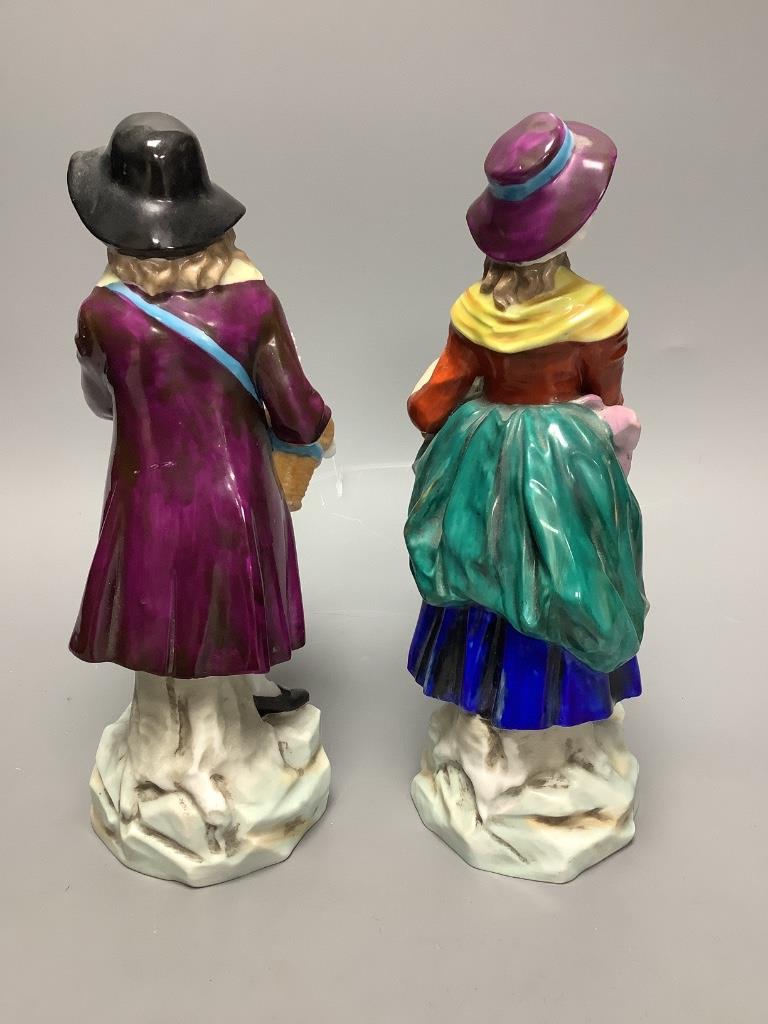 A pair of Continental porcelain figures, height 24cm